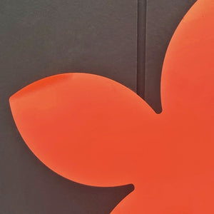 Close up of the bright orange frangipani wall art for outdoors by LisaSarah Steel Designs New Zealand. 