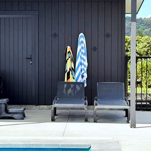 Pool space showing medium cross wall hooks with pool towels. 