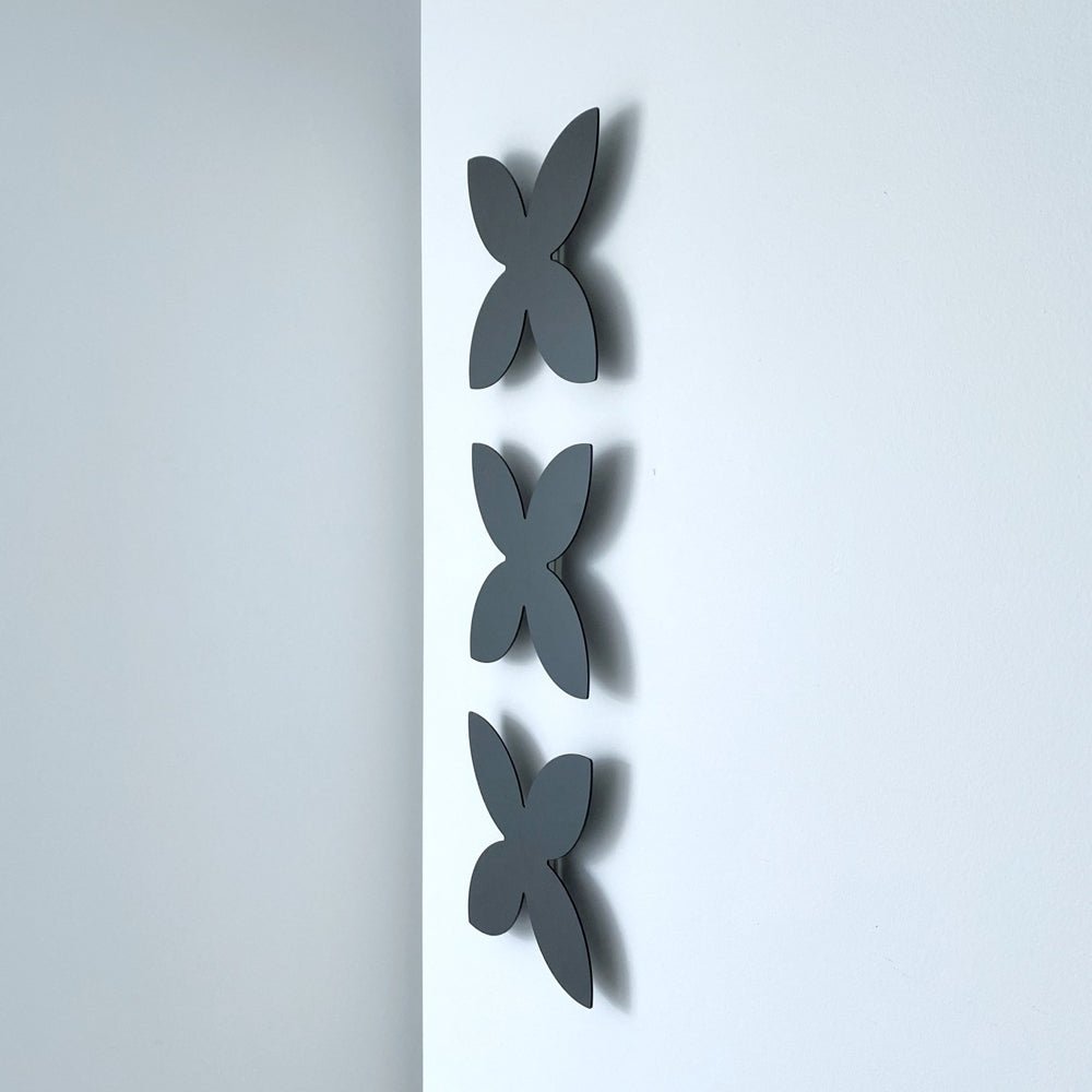 NZ Made Gifts to send overseas.  Frangipnai Set of 3 matt black steel wall art by LisaSarah Steel Designs