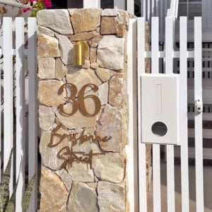 Gold stainless steel modern address sign on Australian Home.